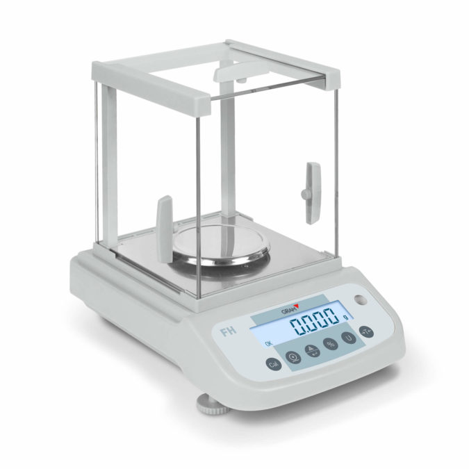Laboratory balance with wind protection to achieve highest weighing accuracy and avoid interferences